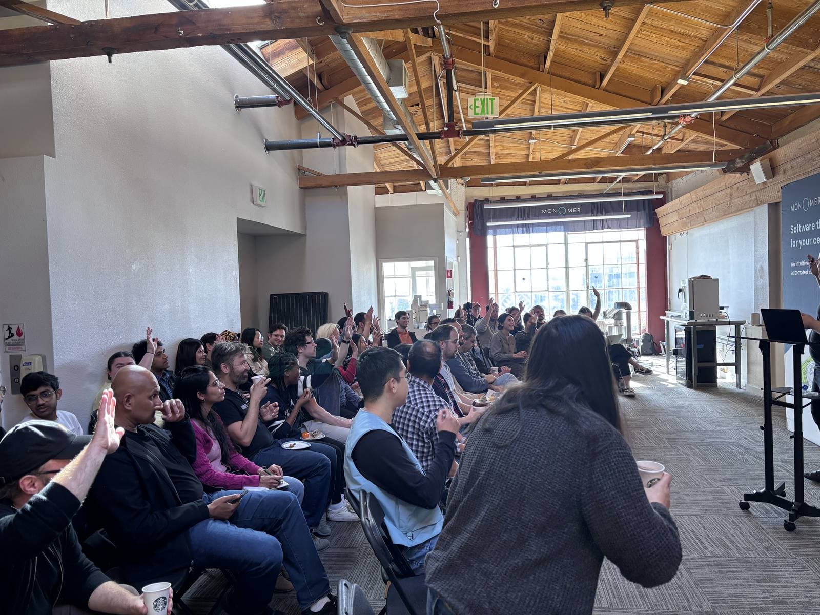 A full room of participants seated for the Cell Culture Hackathon kickoff at Monomer Bio in San Francisco.