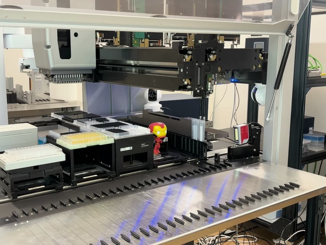 A Hamilton Microlab STAR on a lab bench, its deck loaded with carriers, tip racks and a microplate.