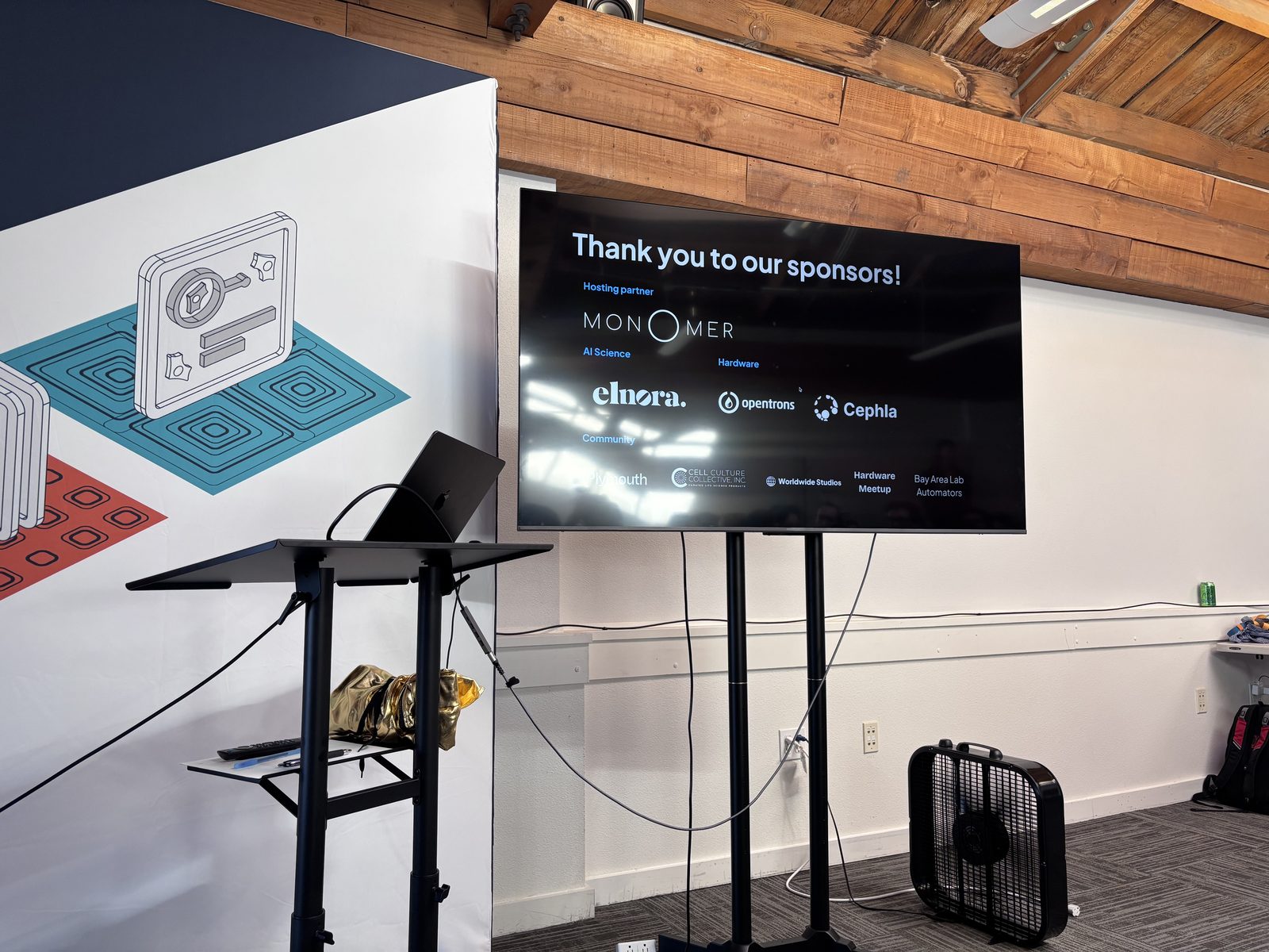 The sponsor screen at Monomer Bio, listing Elnora among the event's supporters.