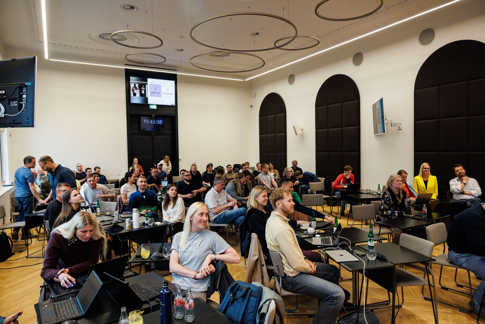The Build Day hall filled with participants during the final presentations.